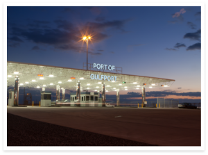 The Port of Gulfport Sign in the Drive Through at Night